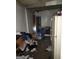 Room view showing the unkempt interior with discarded items, damaged walls, and poor conditions, requiring substantial cleanup at 950 Joseph E Boone Nw Blvd, Atlanta, GA 30314