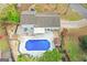 Aerial view of home with pool, shed, outdoor seating, patio, privacy fence, and beautiful landscaping at 205 Raintree Bnd, Peachtree City, GA 30269