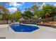 This backyard features a pool, shed, seating, and privacy fence. Plenty of room for entertaining at 205 Raintree Bnd, Peachtree City, GA 30269