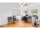 This bedroom is currently being used as a home office with a desk, dual chairs, and ceiling fan at 205 Raintree Bnd, Peachtree City, GA 30269