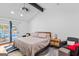 The main bedroom features an ensuite and a sliding glass door which leads to the pool at 205 Raintree Bnd, Peachtree City, GA 30269