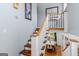 Staircase features hardwood steps, white railings, and plenty of natural light at 205 Raintree Bnd, Peachtree City, GA 30269