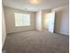 Bright bedroom with neutral carpet, closet and natural light from the window at 661 Outlook Way, South Fulton, GA 30349