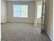 Spacious bedroom with carpet flooring, a large window, and an adjoining room at 661 Outlook Way, South Fulton, GA 30349