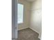Walk-in closet featuring carpet floors, a window, and a wire shelf at 661 Outlook Way, South Fulton, GA 30349