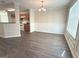 Inviting dining room featuring modern flooring, classic wainscoting, and a stylish chandelier at 661 Outlook Way, South Fulton, GA 30349