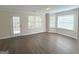 Cozy sunroom featuring neutral walls, new flooring and abundant natural light at 661 Outlook Way, South Fulton, GA 30349