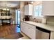 Bright kitchen featuring white cabinets, stainless steel appliances, and an attached dining area at 1475 Woodington Cir, Lawrenceville, GA 30044