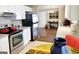 The kitchen offers white cabinets, stainless steel appliances, and an adjacent entryway at 1475 Woodington Cir, Lawrenceville, GA 30044