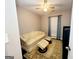 Sitting room with a sofa, two ottomans, hardwood floors, and a ceiling fan at 1475 Woodington Cir, Lawrenceville, GA 30044