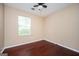 Clean bedroom with hardwood floors and a window with natural light at 4691 Garden Hills Ct, Stone Mountain, GA 30083