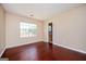 Light-filled bedroom boasts hardwood floors and a view of the outdoor scenery at 4691 Garden Hills Ct, Stone Mountain, GA 30083