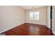 Bedroom featuring hardwood floors, natural light, and access to a bathroom at 4691 Garden Hills Ct, Stone Mountain, GA 30083
