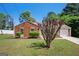 Inviting single-story home with a well-manicured lawn and mature landscaping at 4691 Garden Hills Ct, Stone Mountain, GA 30083