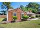 Charming single-story home featuring wood-look siding, shutters, and well-maintained landscaping at 4691 Garden Hills Ct, Stone Mountain, GA 30083