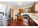 Well-equipped kitchen with stainless steel appliances and updated countertops at 4691 Garden Hills Ct, Stone Mountain, GA 30083