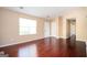 Bright living room with hardwood floors and a large window for ample natural light at 4691 Garden Hills Ct, Stone Mountain, GA 30083