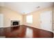 Inviting living room featuring hardwood floors, a stone fireplace, and natural light at 4691 Garden Hills Ct, Stone Mountain, GA 30083