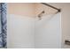 Shower with white tiled walls and a silver shower head at 4691 Garden Hills Ct, Stone Mountain, GA 30083