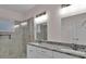 Modern bathroom features a double vanity, granite countertop, and a glass-enclosed tile shower at 250 Stonecreek Pkwy, Covington, GA 30016