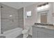 Modern bathroom has a shower with tile surround, and granite countertop at 250 Stonecreek Pkwy, Covington, GA 30016