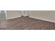 Spacious bedroom showcases hardwood floors and en suite bathroom at 250 Stonecreek Pkwy, Covington, GA 30016