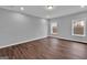 Bedroom with hardwood floors, a neutral color palette, and natural lighting at 250 Stonecreek Pkwy, Covington, GA 30016