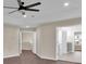 Open-concept living area showcasing hardwood flooring and access to the en suite bath at 250 Stonecreek Pkwy, Covington, GA 30016
