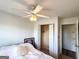 Simple bedroom with a ceiling fan, closet, and ample natural light at 304 Commons Dr, Jonesboro, GA 30236
