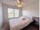 Neutral bedroom showcasing a window and a cozy bed at 304 Commons Dr, Jonesboro, GA 30236