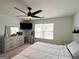 Well-lit bedroom with neutral walls and a dark ceiling fan at 304 Commons Dr, Jonesboro, GA 30236