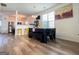 Inviting dining area features wood floors, modern lighting, and an open layout to the kitchen, creating an ideal space for meals at 304 Commons Dr, Jonesboro, GA 30236