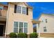 Charming two-story home with a manicured lawn, well-placed shrubbery, and a welcoming front porch, creating great curb appeal at 304 Commons Dr, Jonesboro, GA 30236