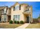 Charming two-story home with a manicured lawn, well-placed shrubbery, and a welcoming front porch, creating great curb appeal at 304 Commons Dr, Jonesboro, GA 30236