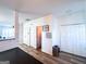 Hallway with gray wood-look floors featuring multiple interior and closet doors at 304 Commons Dr, Jonesboro, GA 30236