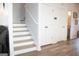Hallway with wood flooring and stairway at 304 Commons Dr, Jonesboro, GA 30236