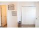 Hallway with gray wood-look floors and closet with white paneled doors at 304 Commons Dr, Jonesboro, GA 30236