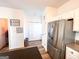 Kitchen featuring stainless steel refrigerator and convenient access to storage at 304 Commons Dr, Jonesboro, GA 30236