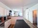 Open floor plan kitchen featuring an island and adjacent living area at 304 Commons Dr, Jonesboro, GA 30236