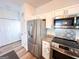Kitchen area featuring stainless steel appliances and stylish backsplash at 304 Commons Dr, Jonesboro, GA 30236