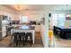 Bright kitchen offers stainless steel appliances, island with seating, and ample cabinets for storage, great for meal preparation and socializing at 304 Commons Dr, Jonesboro, GA 30236