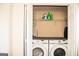 Washer and dryer set inside of a closet at 304 Commons Dr, Jonesboro, GA 30236