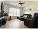Cozy living room features a ceiling fan, a comfortable sofa, and natural light, creating a relaxing space at 304 Commons Dr, Jonesboro, GA 30236