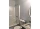 Bathroom featuring a shower-tub combo, toilet, and vanity with granite countertop at 25 Dove Pt, Covington, GA 30016