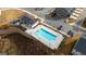 Overhead view of the community pool, clubhouse, and parking area offering recreation and convenience for residents at 1516 Parks Edge Nw Ln, Atlanta, GA 30318