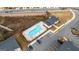 Aerial view of a community pool, clubhouse, and parking, located near residential buildings, offering amenities and convenience at 1516 Parks Edge Nw Ln, Atlanta, GA 30318