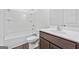 Clean bathroom featuring a shower over tub combination, a toilet, and a vanity with a dark wood cabinet at 1516 Parks Edge Nw Ln, Atlanta, GA 30318