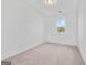 Well-lit, carpeted bedroom with a window offers a serene space to relax and unwind at 1516 Parks Edge Nw Ln, Atlanta, GA 30318