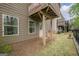 View of backyard with walk out basement entrance and exterior balcony at 2705 Maple Park Pl # 29, Cumming, GA 30041