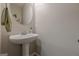 Powder room with pedestal sink and modern mirror at 2705 Maple Park Pl # 29, Cumming, GA 30041